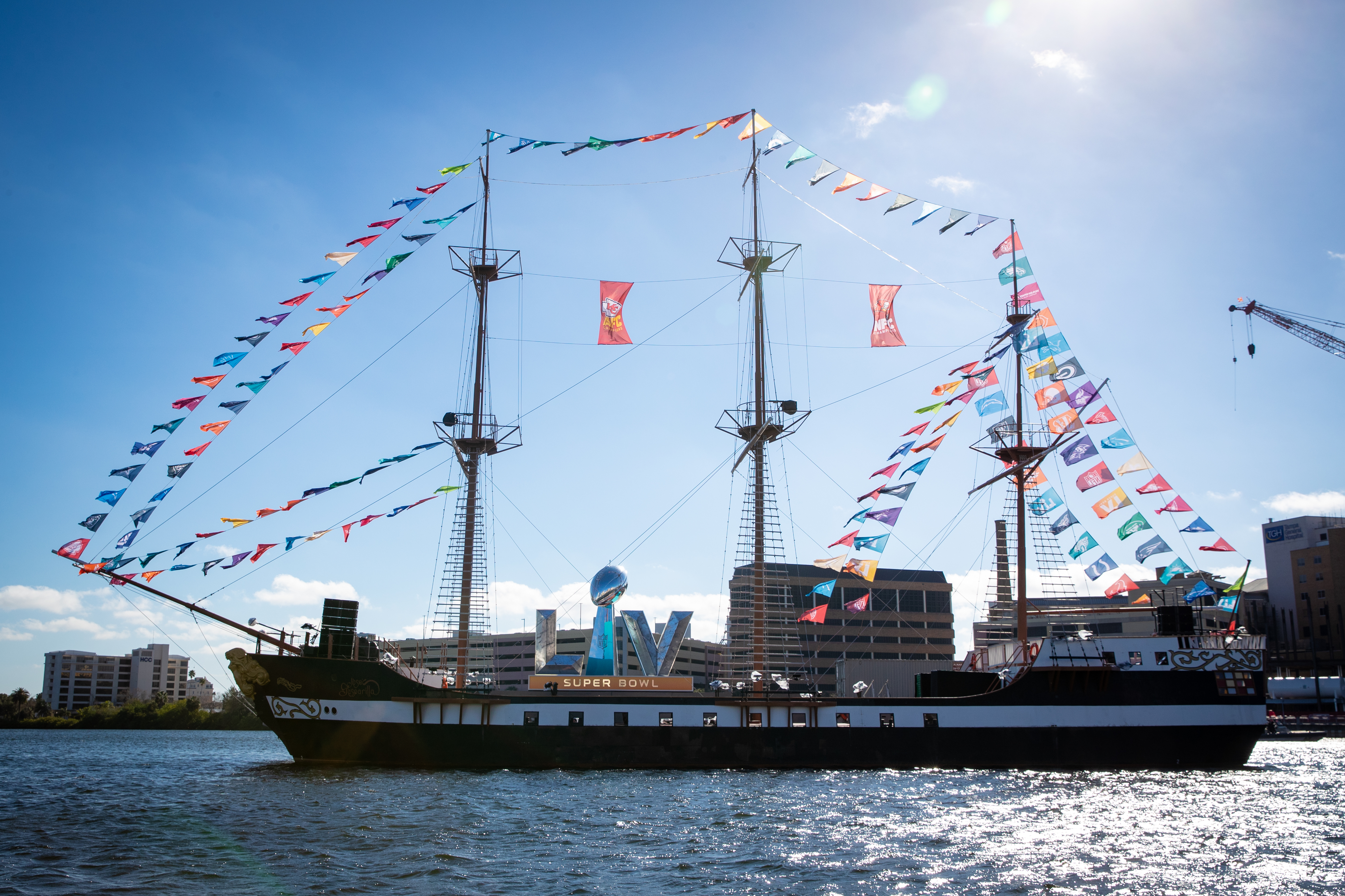 The Jose Gasparilla II pirate ship sailing into Tampa Bay during the annual festival, surrounded by spectator boats